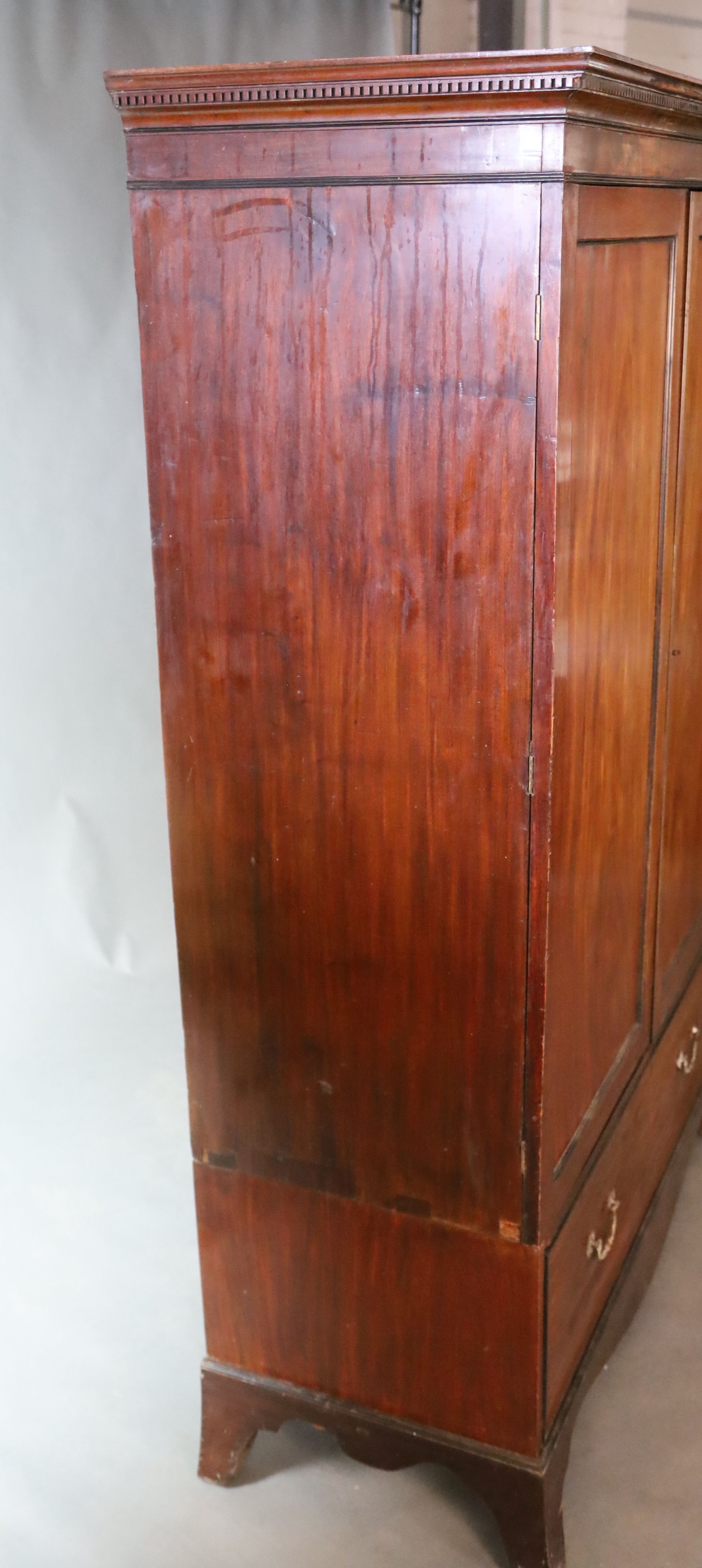 An early 19th century mahogany press cupboard, W.119.5cm D.54.5cm H.188cm